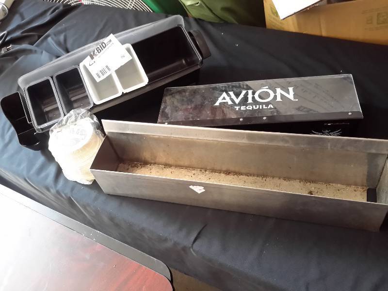 lot 76 image: Stainless bar rack.. Acrylic Bar product server with flip cover,