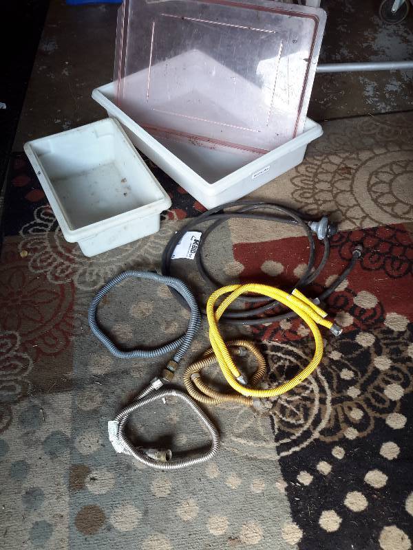 lot 63 image: Misc. Gas Lines and plastic container with cover