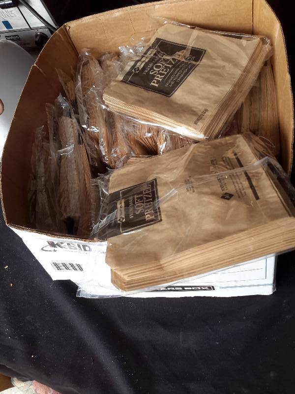lot 77 image: Box of Pretzel paper sleeves.