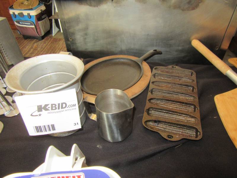 lot 31 image: 2 measure pitchers, Cast Corn pan, cast hot pan with pan