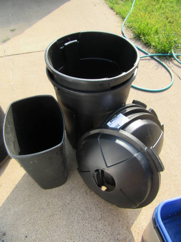 lot 88 image: 2 large plastic barrells and 4 covers with recycle holes..