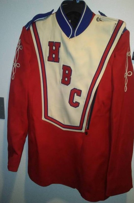 lot 19 image: 4 band uniform tops  jacket, red, white, and blue. Four sizes