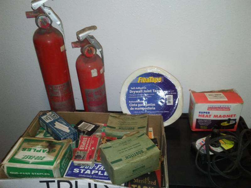 lot 54 image: Misc. Garage Items Fire extinguishers, magnet heater, drywall tape, thousands of Staples.
