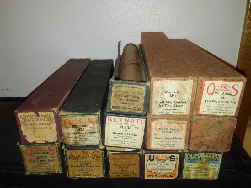 lot 85 image: 13 player piano music rolls in boxes.