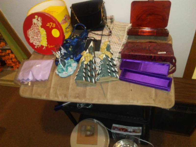 lot 134 image: Purses, decor, memory foam bath mat, black light, speaker, Jell-O mold (new in package) and more