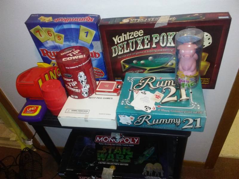 lot 139 image: Games, Star Wars, Monopoly, cows, Pig, monkeys, Uno and non-animal related games.