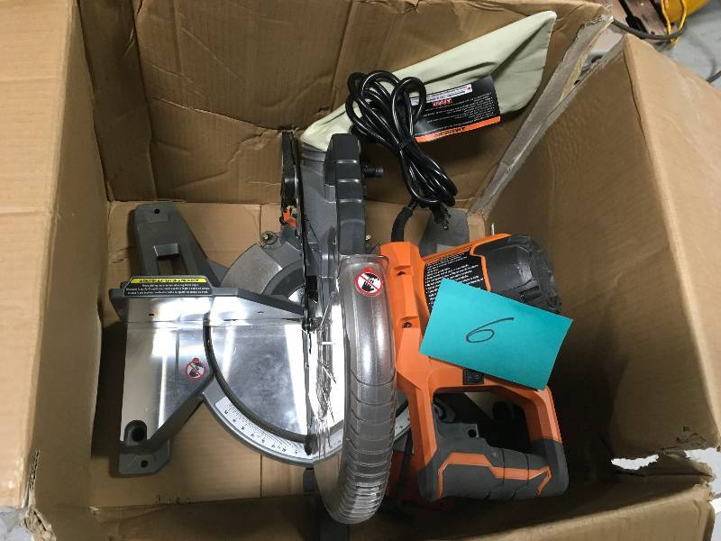 lot 6 image: RIDGID 15 Amp 10 in. Dual Bevel Miter Saw in working conditions