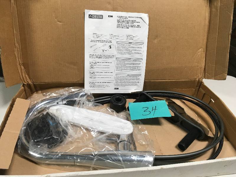 lot 34 image: Delta Essa Single-Handle Bar Faucet with MagnaTite Docking in Chrome in good condition