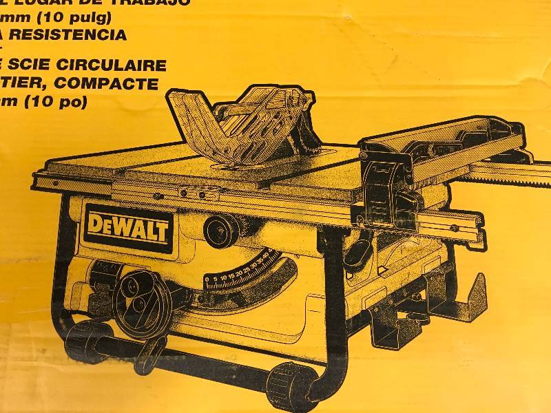 lot 128 image: DEWALT 15 Amp 10 in. Compact Job Site Table Saw with Site-Pro Modular Guarding System open box in like new condition