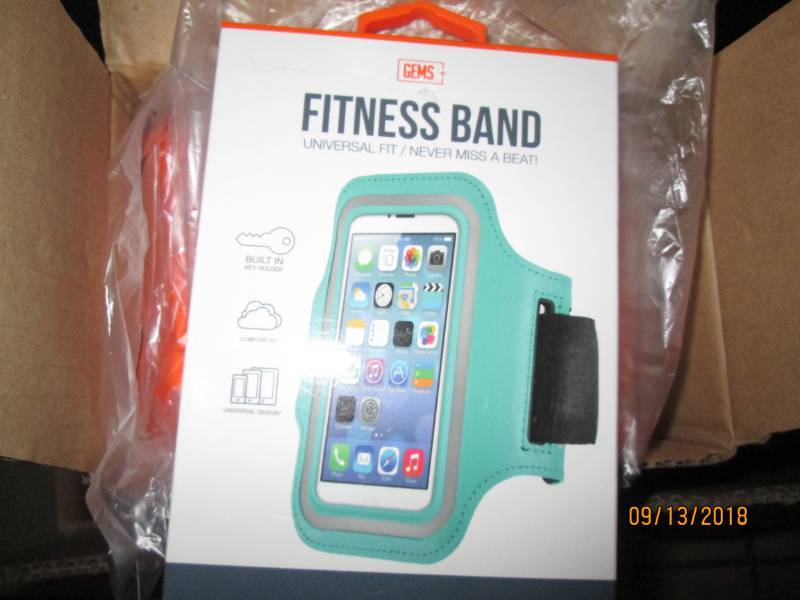 lot 319 image: Case of 48 Gems Fitness Bands wrist phone holders.  Teal