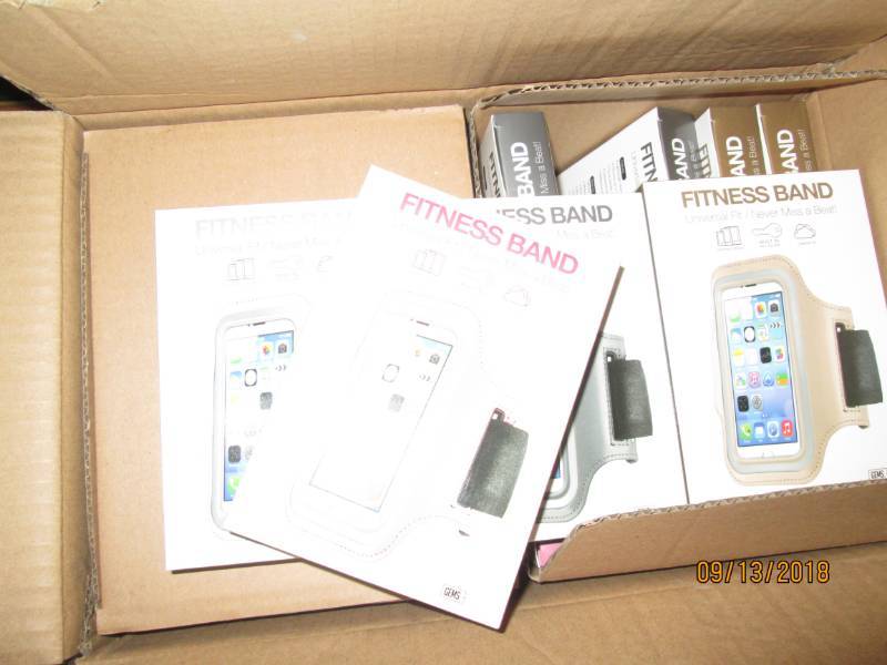 lot 314 image: Case of 48 Gems Fitness Bands wrist phone holders.  Mix of 4 metallic colors