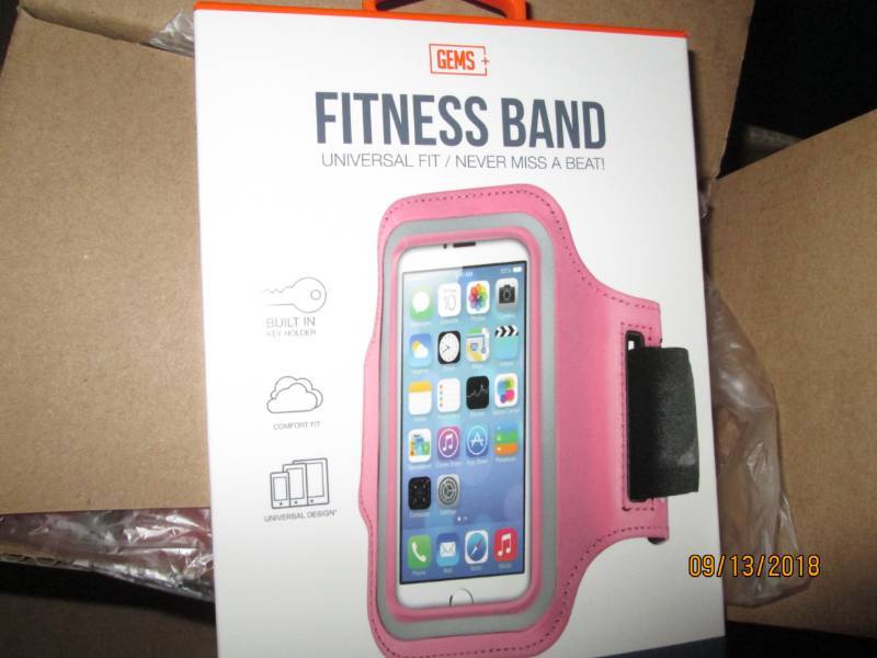 lot 317 image: Case of 48 Gems Fitness Bands wrist phone holders.  Magenta