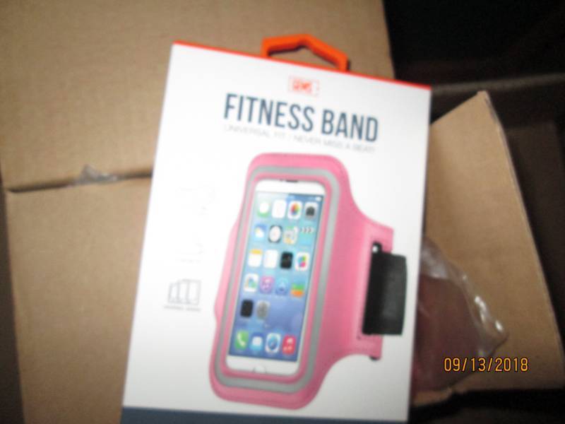 lot 318 image: Case of 48 Gems Fitness Bands wrist phone holders.  Magenta