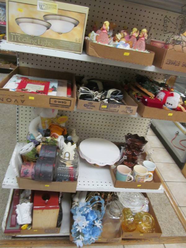 lot 3 image: statues, ceiling light, exercise equipment, canisters, Avon collectibles
