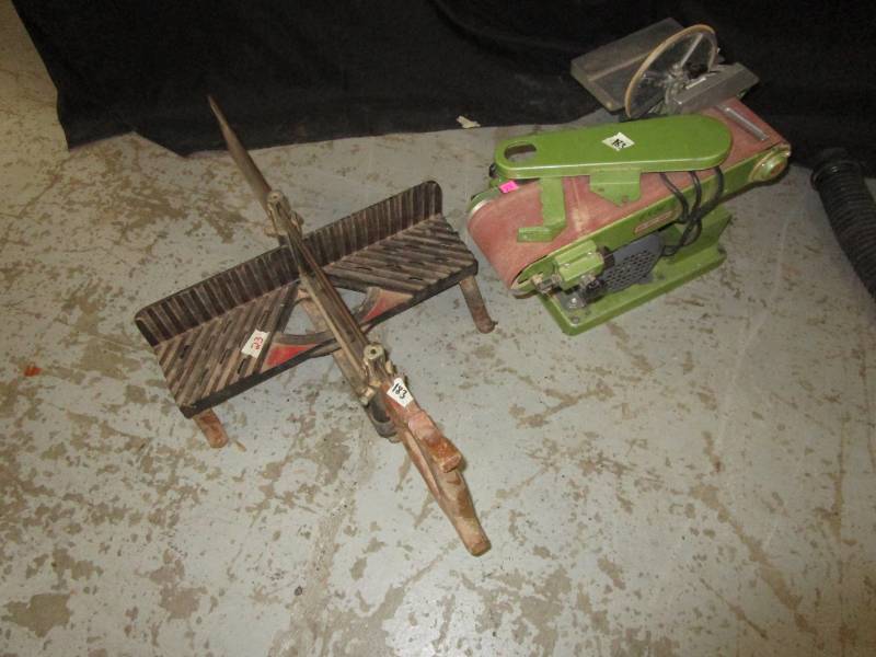 lot 23 image: Belt and Disk Sander 4 inch along with a Saw