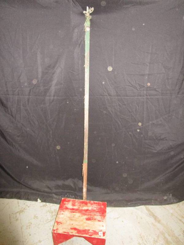 lot 28 image: Old Little Wood Stool with Water Sprinkler