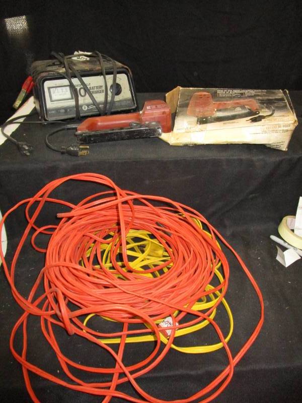 lot 102 image: Staple Gun, Battery Charger and 2 Ext. Cords