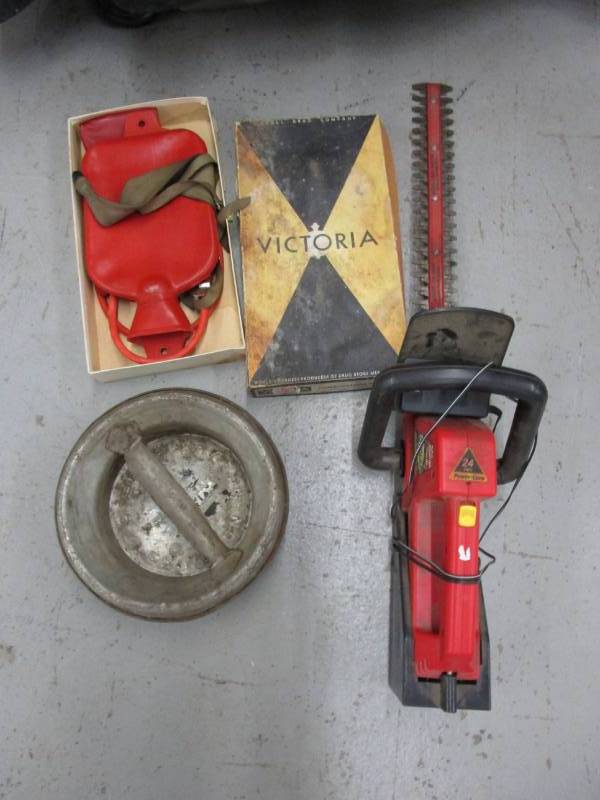 lot 124 image: 24 volt cordless hedger, milk can top, and Victoria combination syringe
