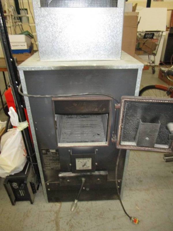 Daka wood furnace w/forced thermostatic blower | September mixed Estates  featuring Tools, Garage Items and Much More!! | K-BID