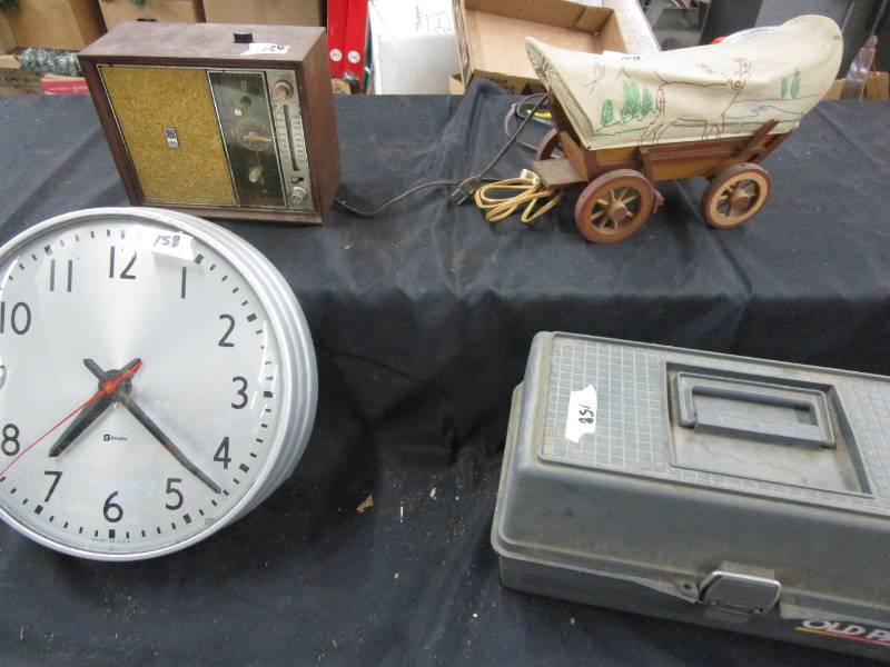 lot 160 image: 12  simplex clock. made in usa.  Covered wagon lamp. Clock radio. Tackle box.
