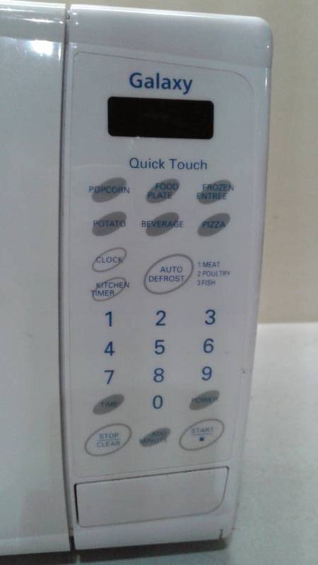 lot 11 image: Galaxy 700w Microwave, Used, Some Wear, Works Good
