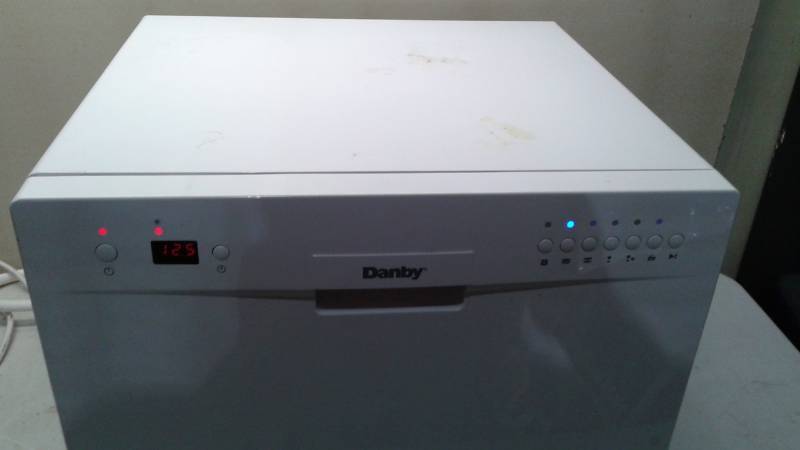 lot 12 image: Danby Countertop Dish Washer, Briefly Tested, Powered, On Worked, Button Sometimes Gets Stuck On One Setting, Used, Shows Some Wear