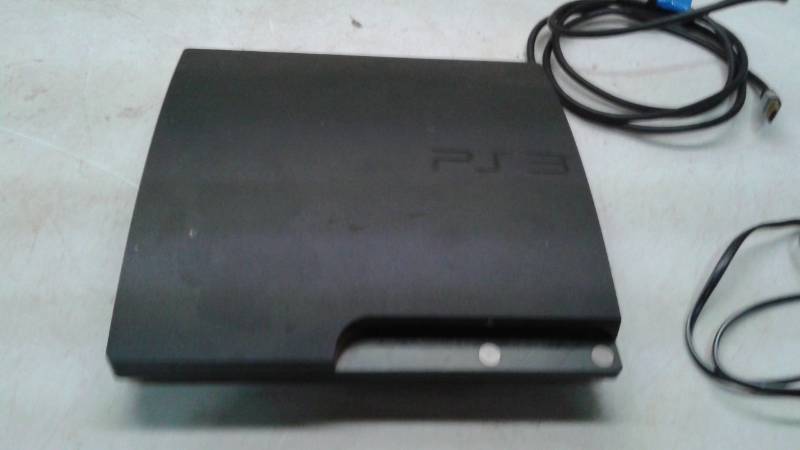 lot 19 image: Playstation 3 Video Game PS3 Console Has Wires But No Controller, Works But Doesnt Read Discs, Has Movies And Some Demo Games Downloaded On It
