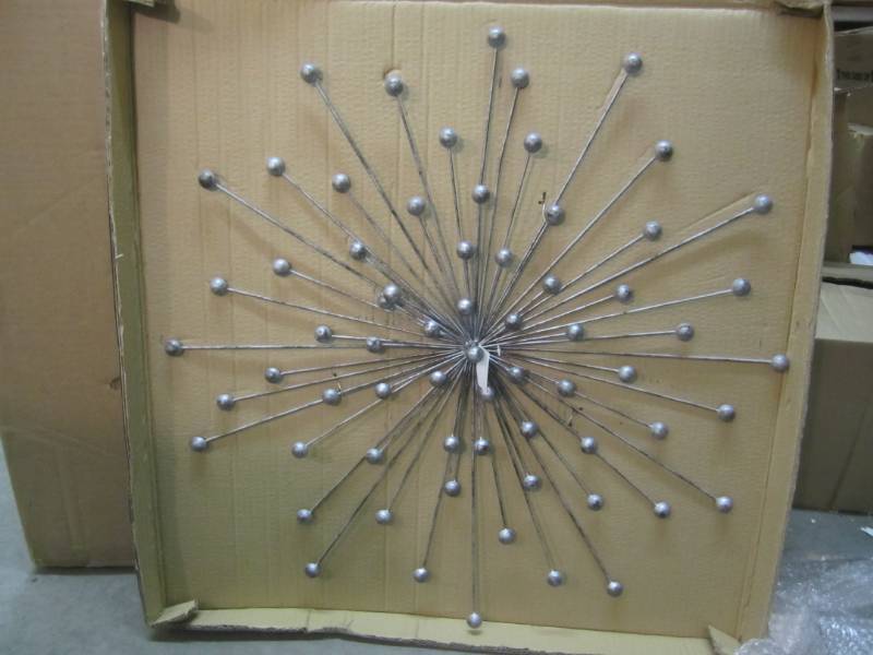 lot 37 image: Stratton Home Decor Metal Burst Wal...