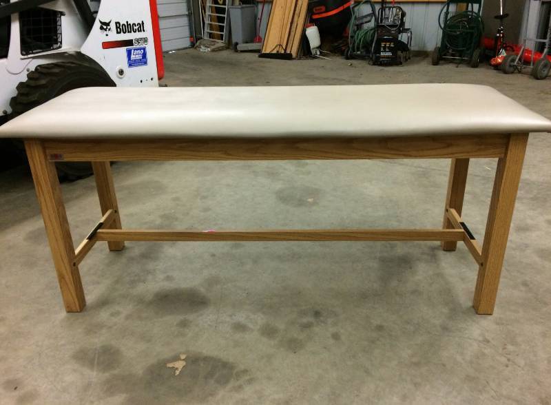 lot 5 image: Hausmann Wooden Exam Treatment Table with H-Brace & Storage Shelf - Excellent Condition