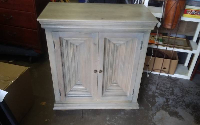 lot 4 image: 2-Door Storage Cabinet (unique doors have a concave layered look) 35x18x42