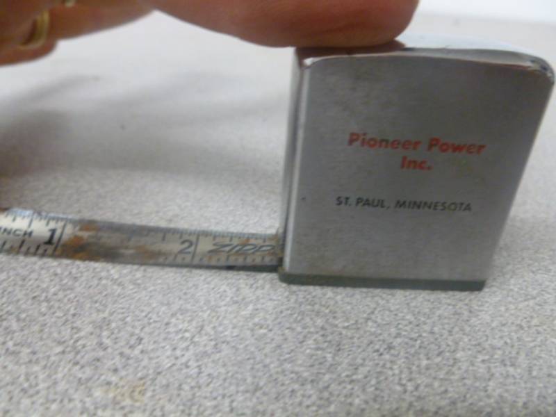 lot 124 image: Zippo Tape Measure