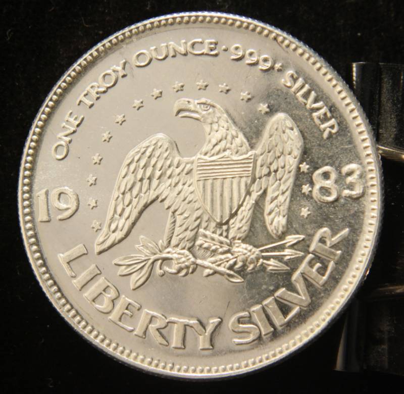 lot 42 image: 1 TROY OZ. .999 FINE SILVER 1983 A-MARK LIBERTY ROUND