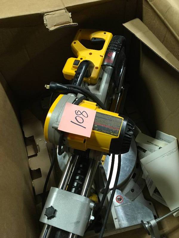 lot 108 image: Dewalt 15 Amp 12 in. Double Bevel Sliding Compound Miter Saw open box in like new condition DWS780 missing dust bag