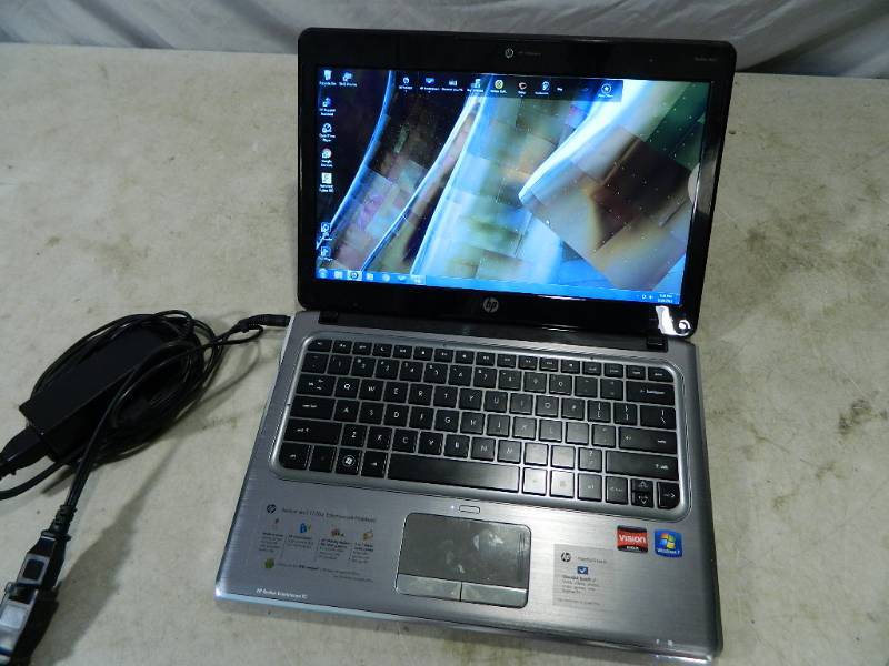 lot 116 image: HP Laptop and Charger