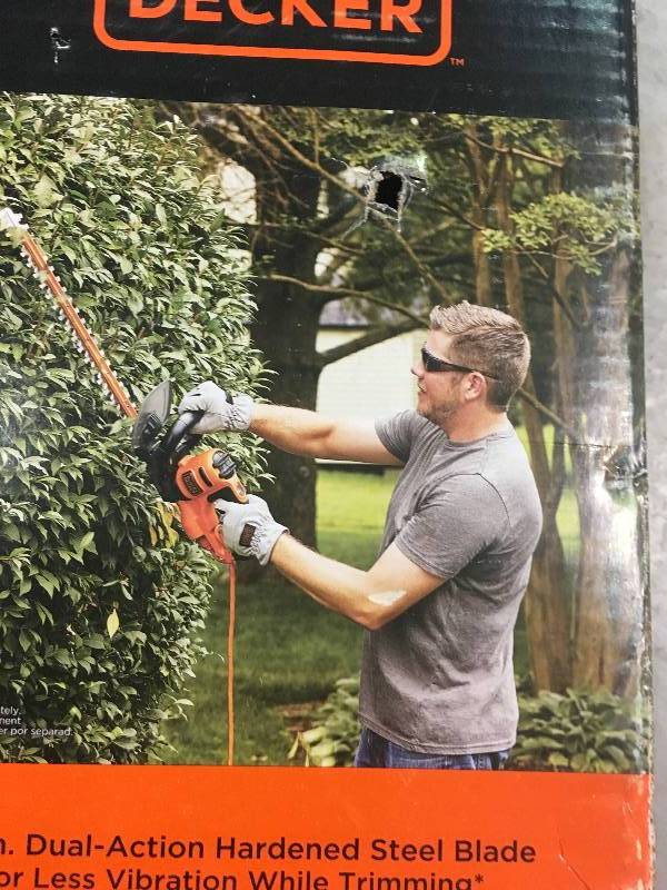 lot 76 image: Black & Decker 20 in. 3.8-Amp Corded Electric Hedge Trimmer in good working condition