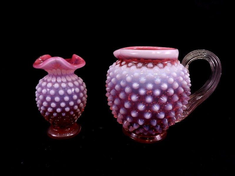 lot 8 image: Vintage Fenton Cranberry Pink and White Opalescent Hobnail Ruffled Glass Vase and Pitcher