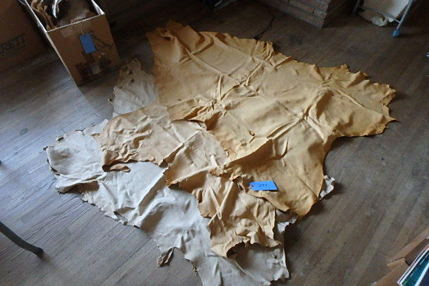 lot 394 image: Three Natural Tanned Buck Skins