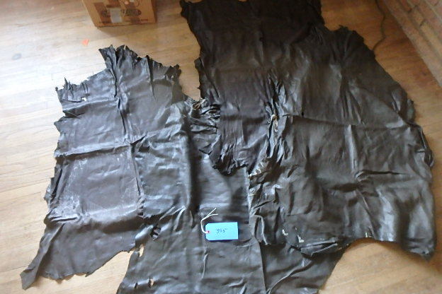 lot 395 image: Three Chocolate Brown Tanned Buck Skins