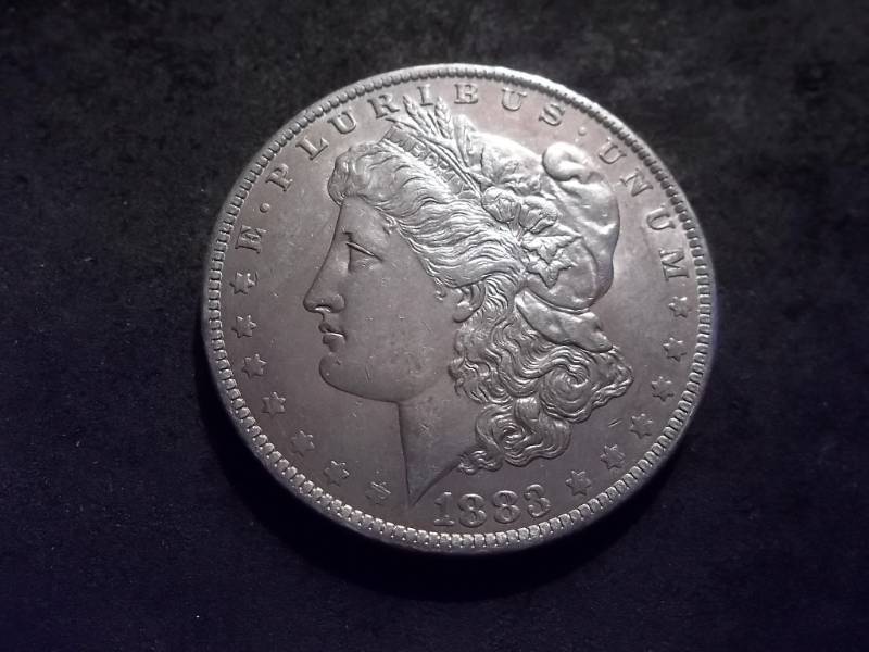 lot 21 image: 1883 O Morgan Silver Dollar