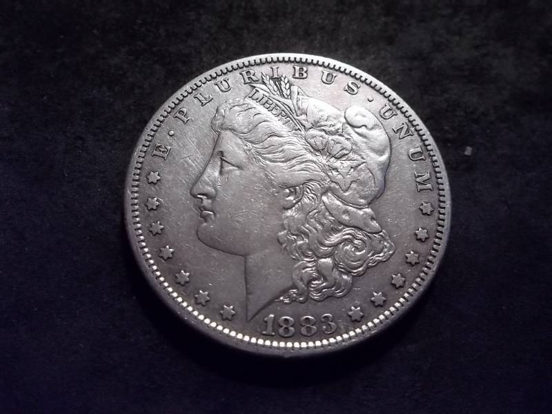 lot 22 image: 1883 S Morgan Silver Dollar