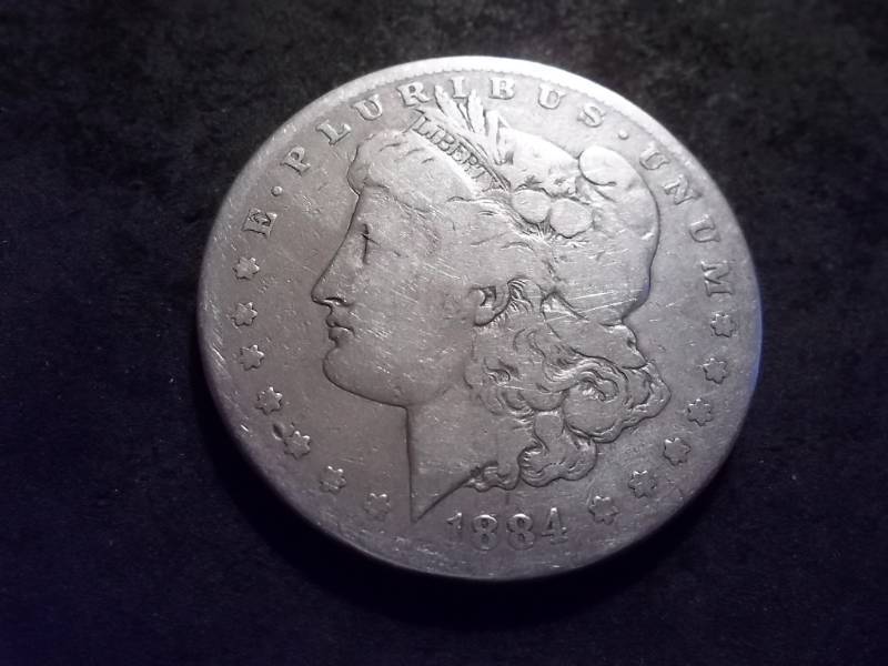 lot 25 image: 1884 S Morgan Silver Dollar