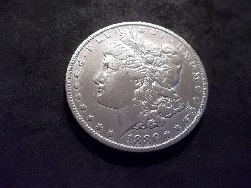 lot 30 image: 1886 O Morgan Silver Dollar