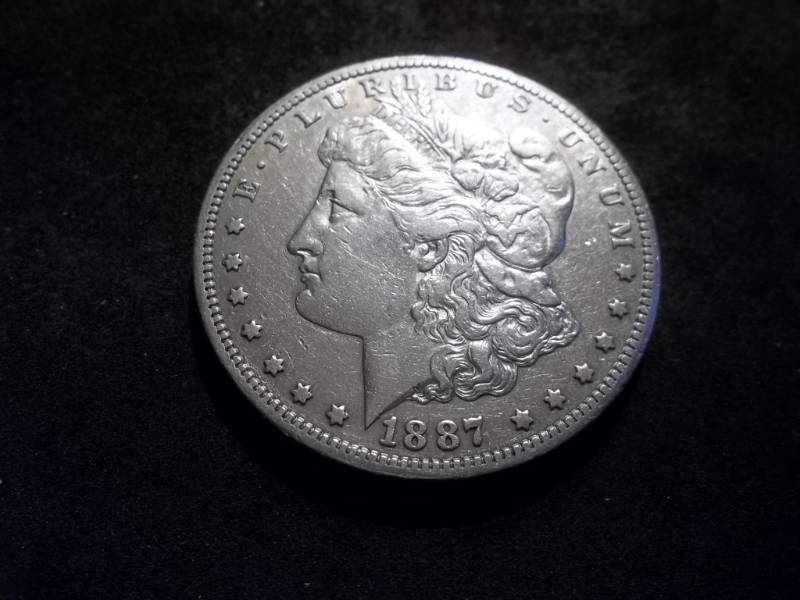 lot 32 image: 1887 S Morgan Silver Dollar