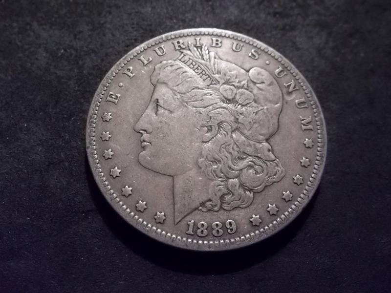 lot 35 image: 1889 O Morgan Silver Dollar