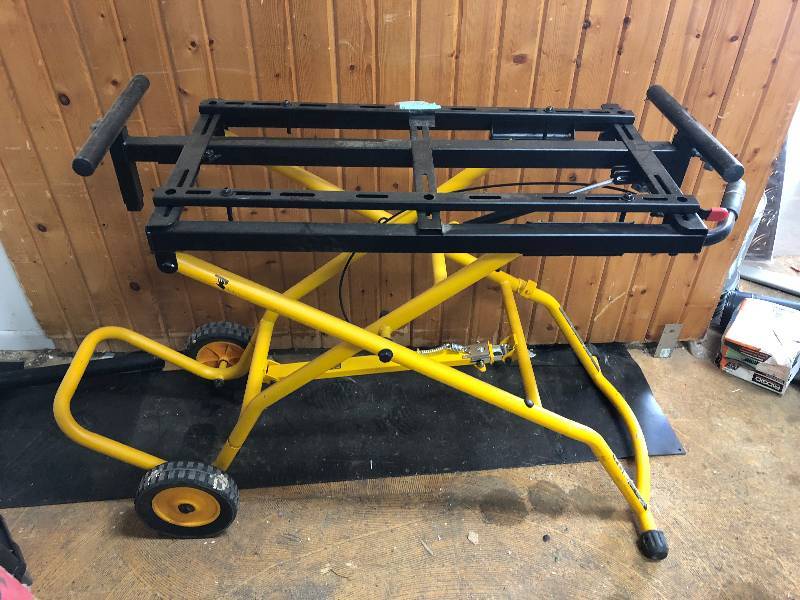 lot 114 image: Dewalt Miter Saw Stand  does not fold down, needs cable replacement or adjustment