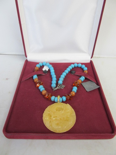 lot 90 image: Large Carved Oriental Style Pendant Necklace