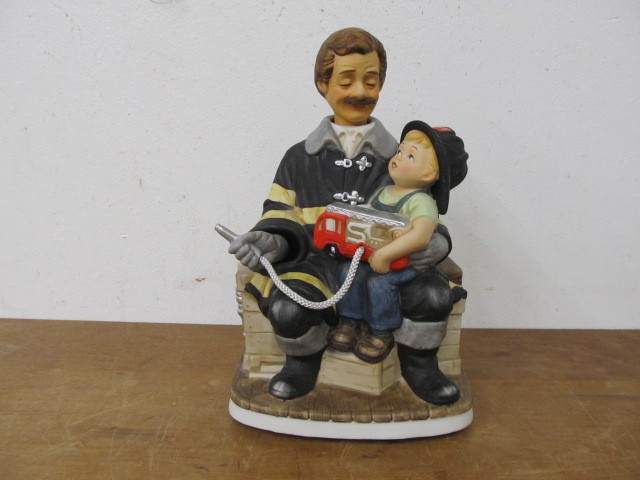 lot 111 image: Large Melody in Motion Fireman wSon Musical Moving Figurine