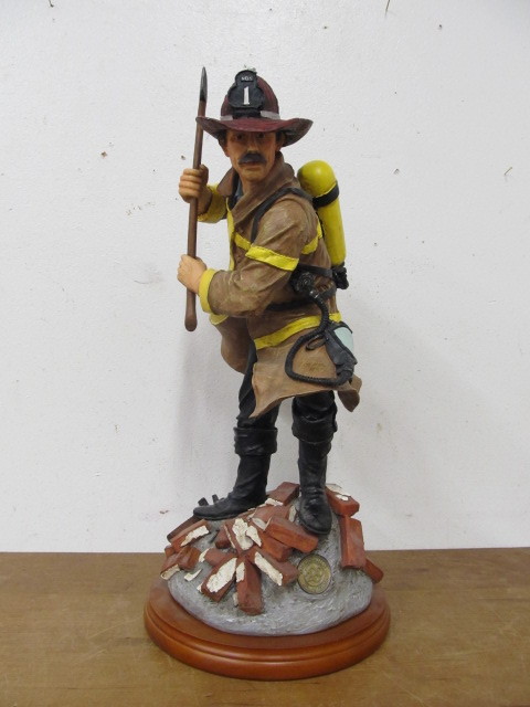 lot 112 image: Large RED HATS OF COURAGE Fireman Statue