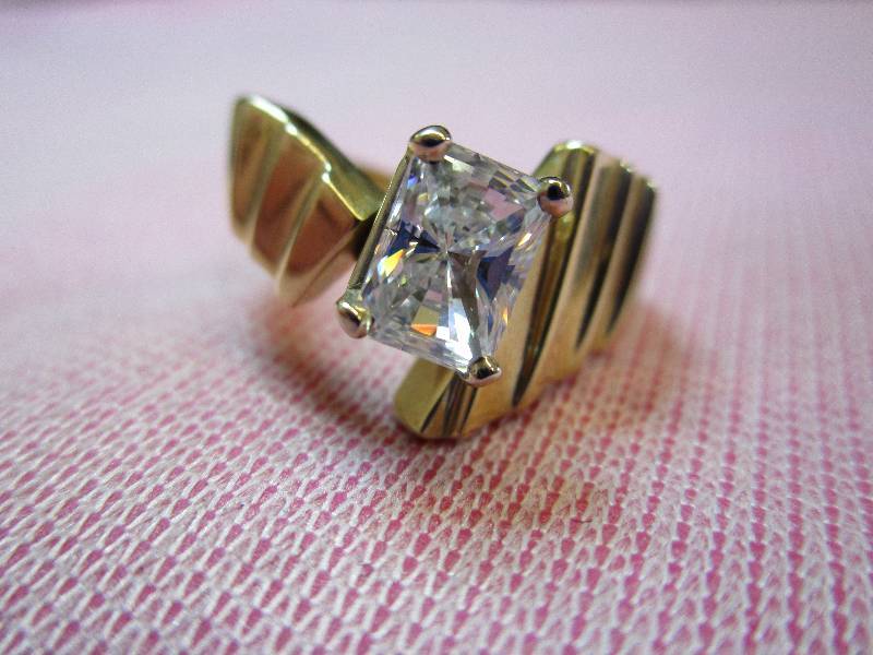 lot 146 image: 14K YELLOW GOLD DIAMONIQUE CZ SIZE 6 WIDE RING, 6.8 GRAMS
