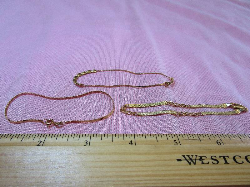lot 155 image: 14K SET OF 3 CHAIN BRACELETS 7, 5.6 GRAMS